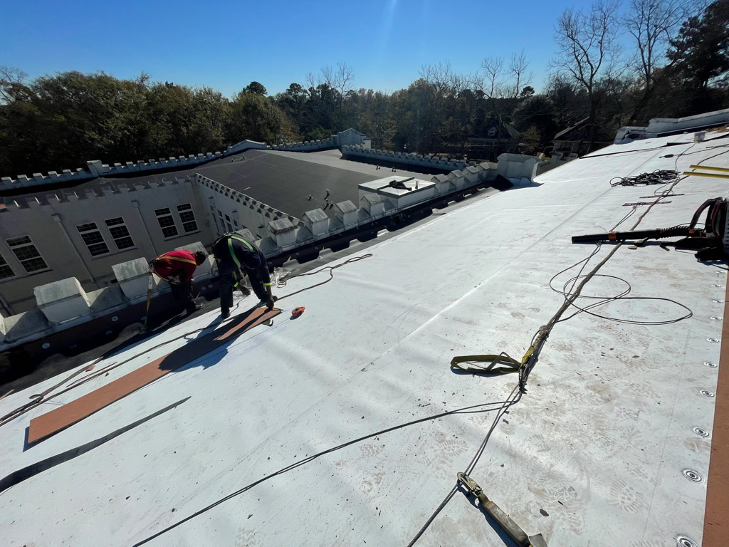 Alan Frank employees working on school roof